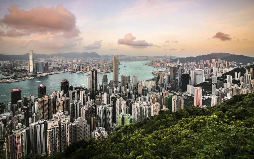 The view from Victoria Peak over Central, the harbour, and Kowloon at dusk